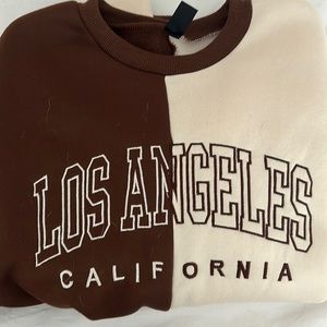 Shein brown and beige crewneck. Size small. Says “LOS ANGELES CALIFORNIA”